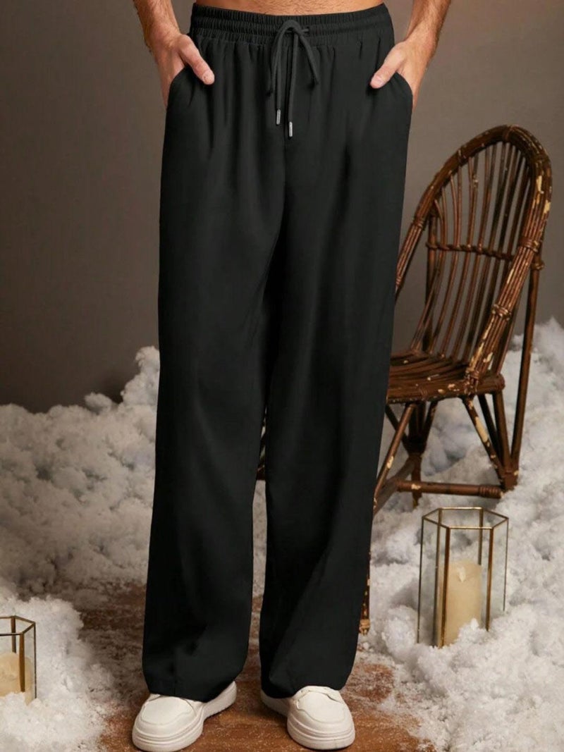 فلاينوف بنطلون رياضي رجالي كوري أسود سادة بقصة فضفاضة - Image 1